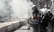 Police Officer Keeps Tear Gas Bomb